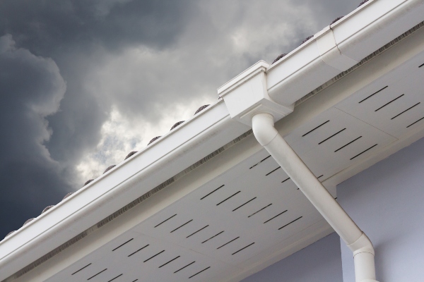 There are many advantages to have metal gutters on your home when storm clouds as dark as those in the picture gather.